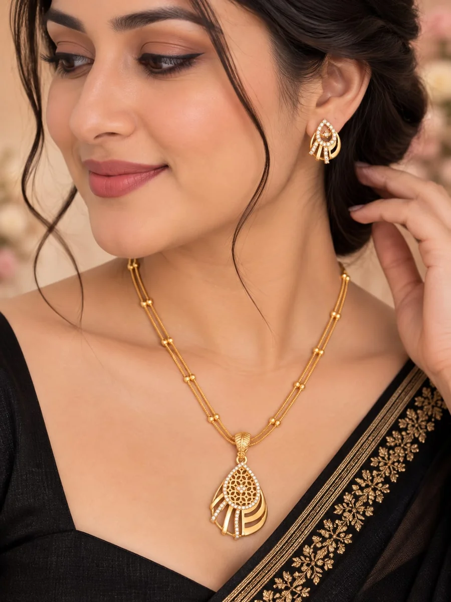 Front view of handcrafted brass Aadhra Teardrop Filigree Statement Set with antique gold polish