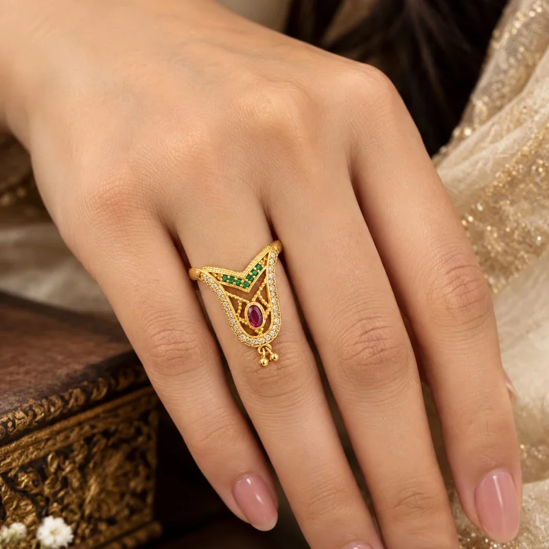 Front view of handcrafted brass Emerald Ruby V-Peacock Ring with antique gold polish